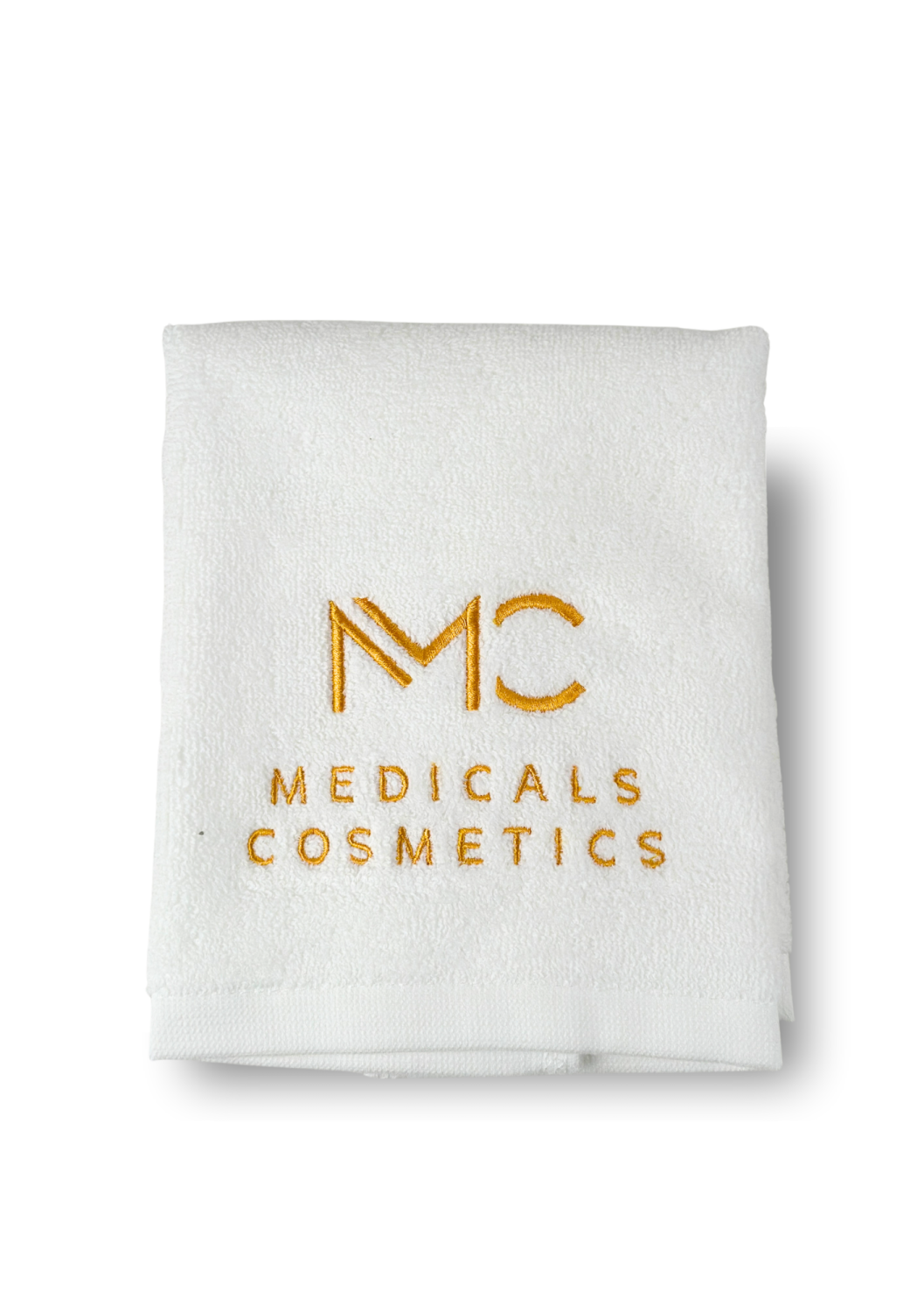 TOWEL MEDICALS COSMETICS SMALL WHITE, GOLDEN LOGO 
Malý bavlnený uterák Medicals Cosmetics biely so zlatou výšivkou